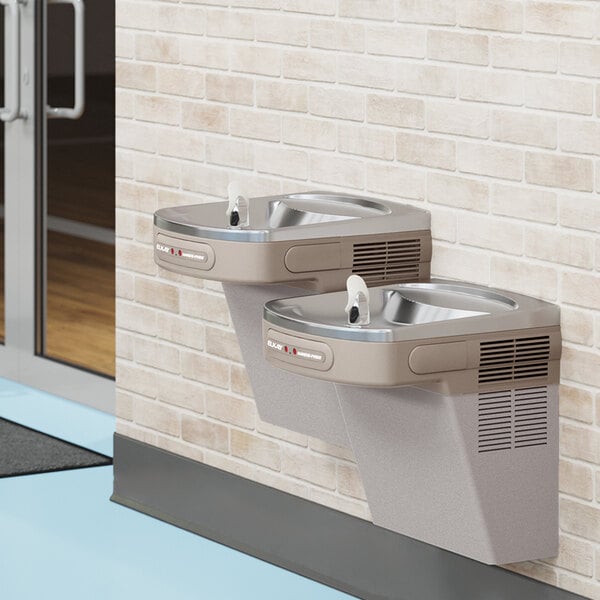 An Elkay light gray wall mount drinking fountain with a vinyl finish.