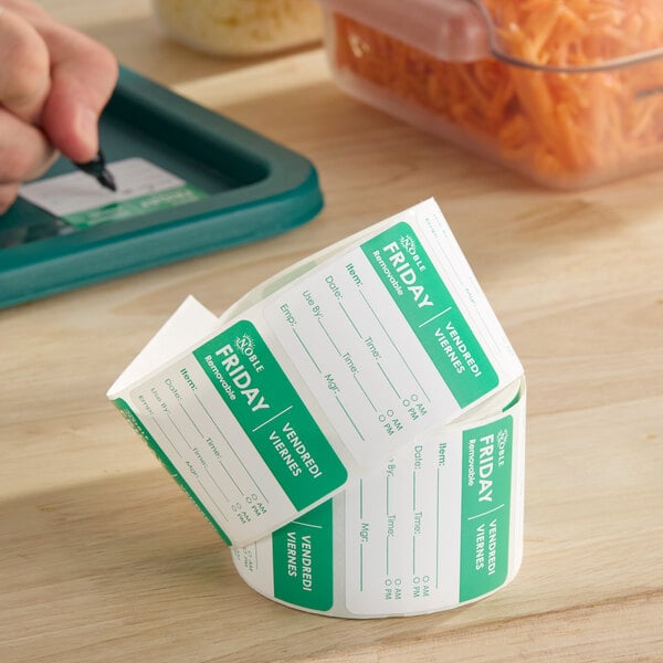 A roll of Noble brand removable Friday day of the week labels, each measuring 2 inches by 2 inches.