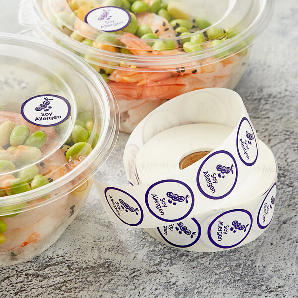 A roll of Point Plus soy allergen food labels with a purple label on it.