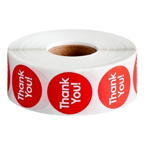 A white roll of Point Plus Thank You stickers with red circles and words.