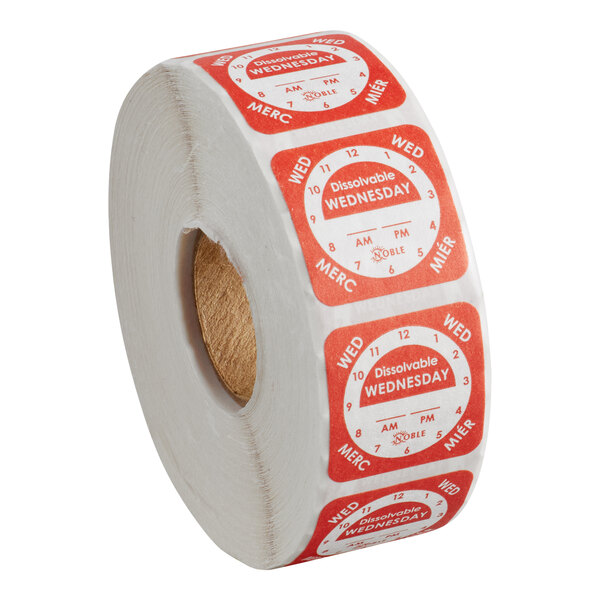 A roll of dissolvable day of the week clock labels marked for Wednesday.