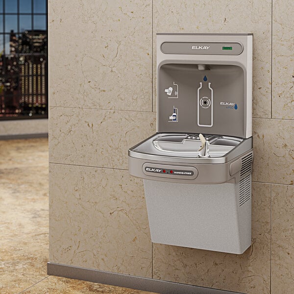 a water fountain with a water bottle