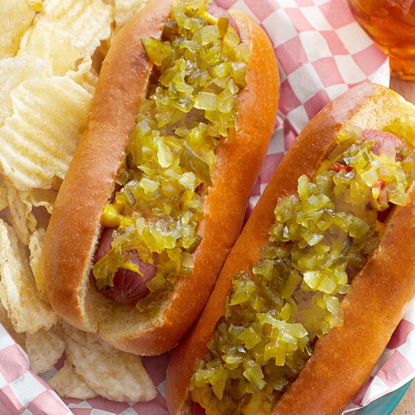 A hot dog with Heinz Deluxe Sweet Relish and chips.