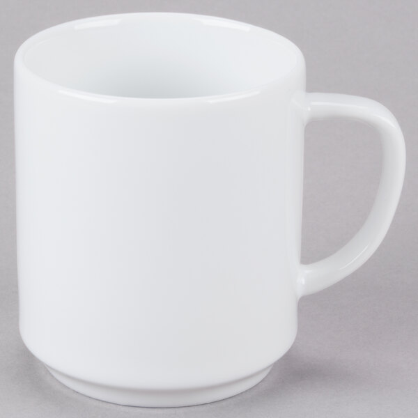 An Arcoroc white porcelain mug with a handle.