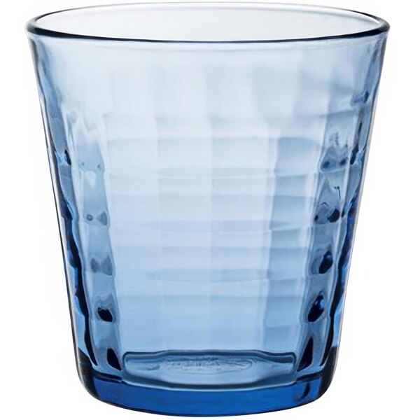 A blue Duralex glass tumbler with a patterned design.