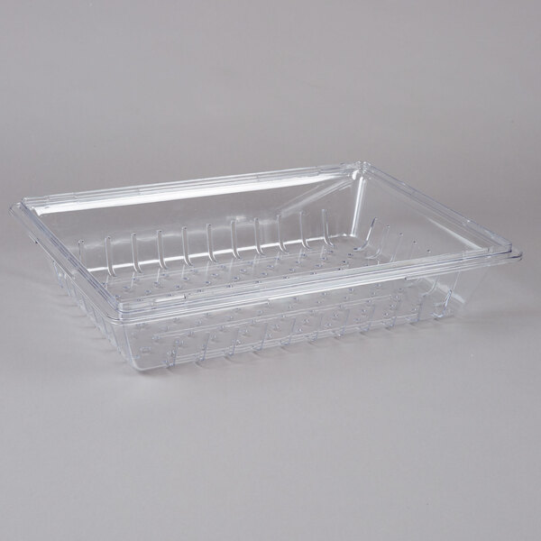 A Carlisle clear plastic food box deep drain tray with a plastic handle and holes.