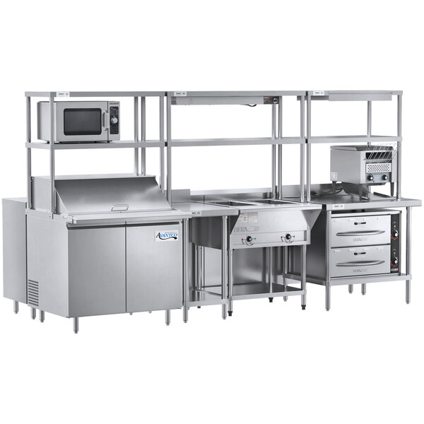 A Chef's Counter stainless steel preparation line in a commercial kitchen.