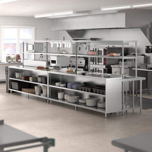 A stainless steel Chef's Counter serving line with a white surface and dish cabinets.