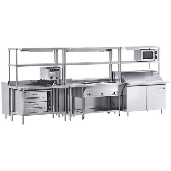 A Chef's Counter stainless steel serving line with steam table, sandwich prep table, and dish cabinets.