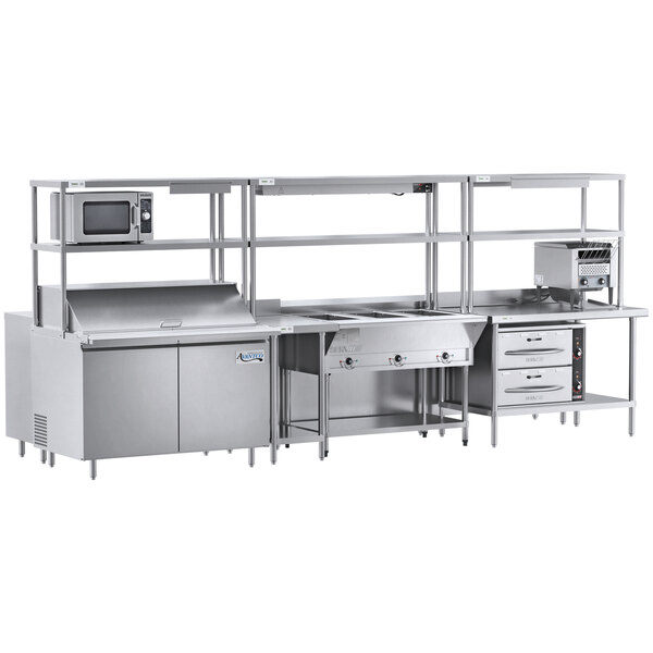 A Chef's Counter serving line with a sandwich prep table, steam table, and dish cabinets.