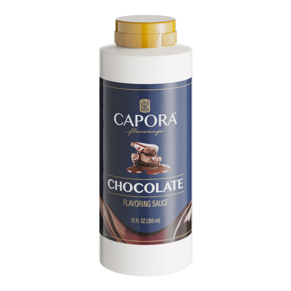 A white Capora bottle of chocolate flavoring sauce with a label.