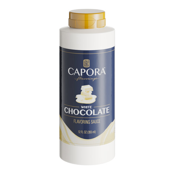 A white bottle of Capora White Chocolate Flavoring Sauce with a blue label.