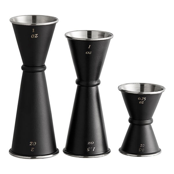 A black metal Acopa Japanese jigger with numbers on it.