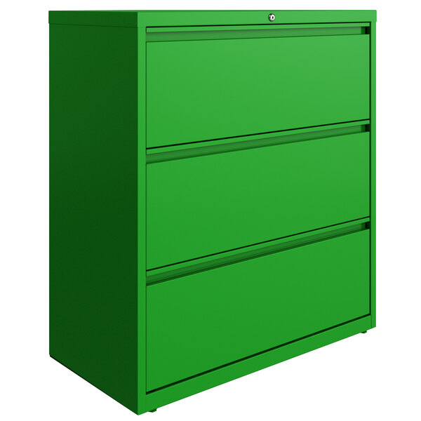 A green three drawer filing cabinet.