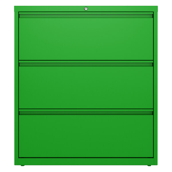 A green file cabinet with three drawers on a white background.