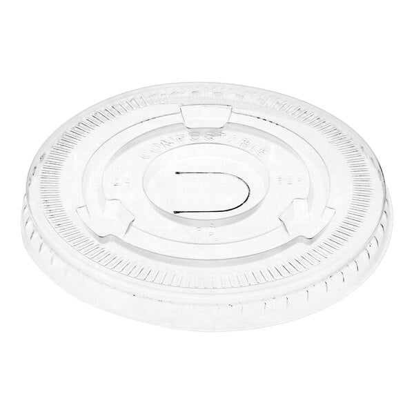 A translucent compostable flat lid with a straw slot designed for use with 9 to 22 oz. cold cups.