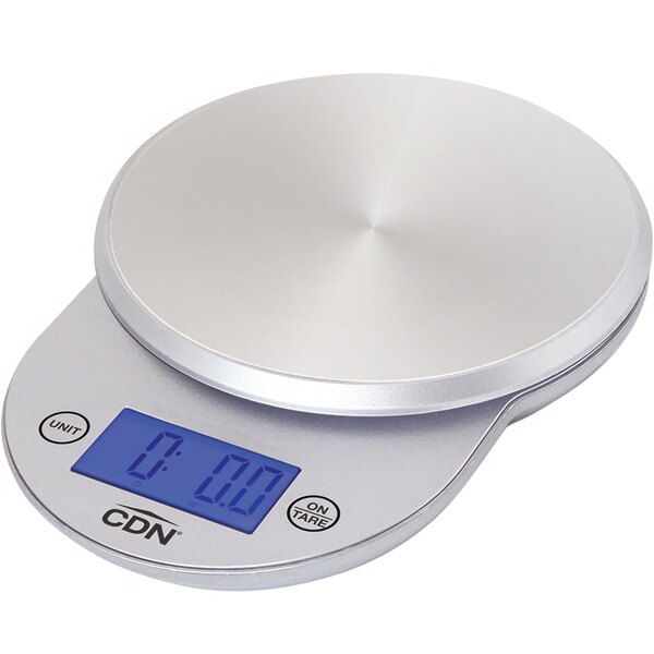 A silver CDN digital portion scale on a counter.