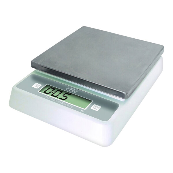 A CDN digital portion scale on a counter.