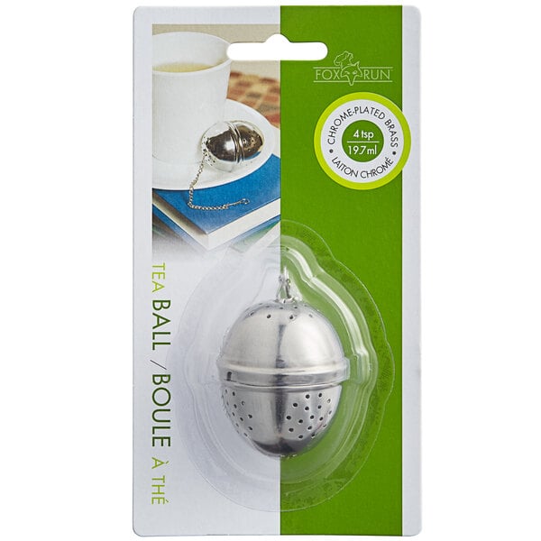 A Fox Run chrome-plated tea ball infuser in a package.