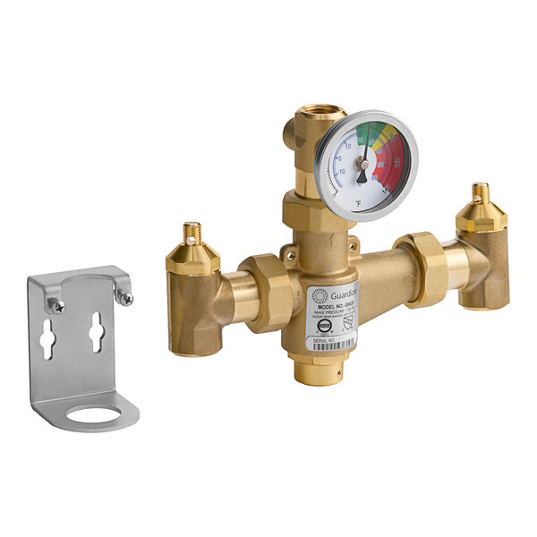 A Guardian Equipment thermostatic mixing valve with a pressure gauge on a gold metal pipe.