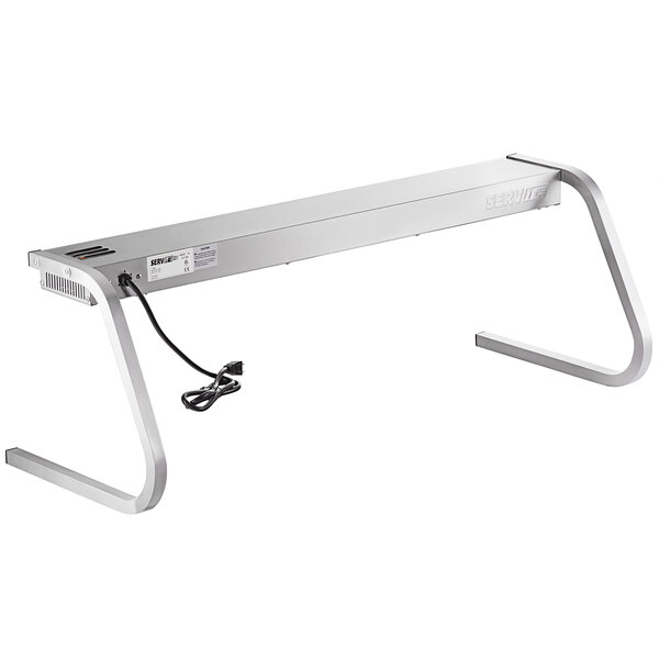 A silver rectangular ServIt strip warmer with a cord and metal legs.