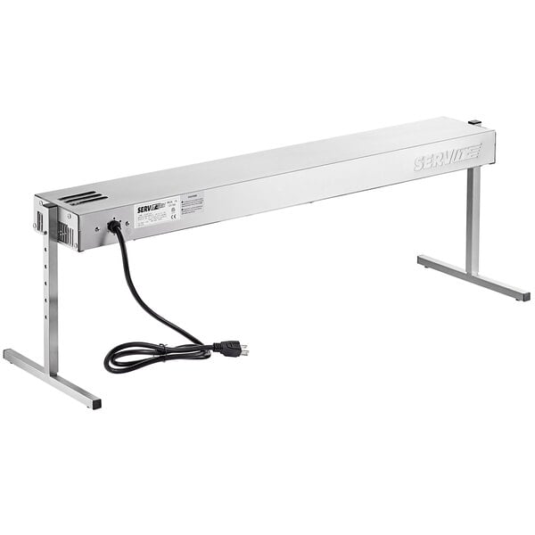 A silver rectangular ServIt strip warmer with a black cord.