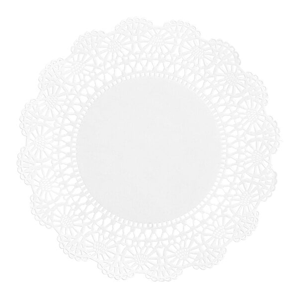 A round white paper doily with an intricate lace-like pattern around the edges and a solid center.