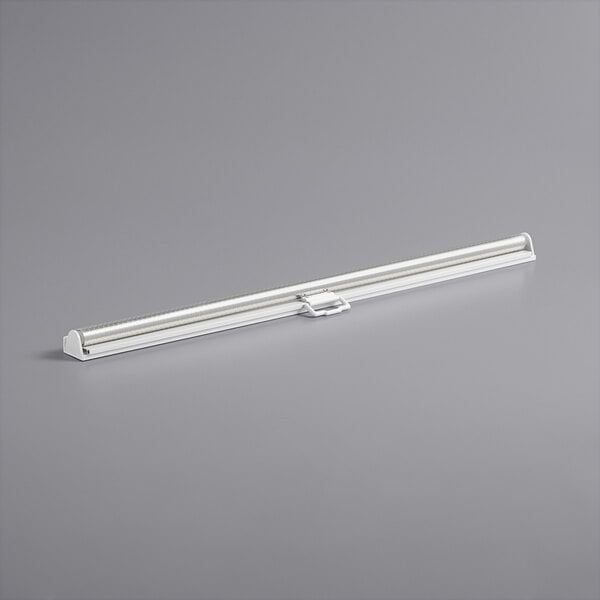 A white metal tube with a handle on it.