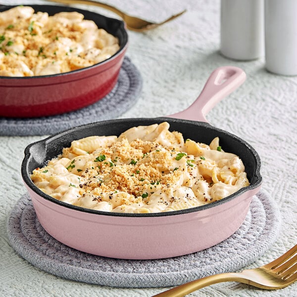 Two pans of macaroni and cheese in Valor Himalayan Salt Mini Cast Iron Skillets on a table.