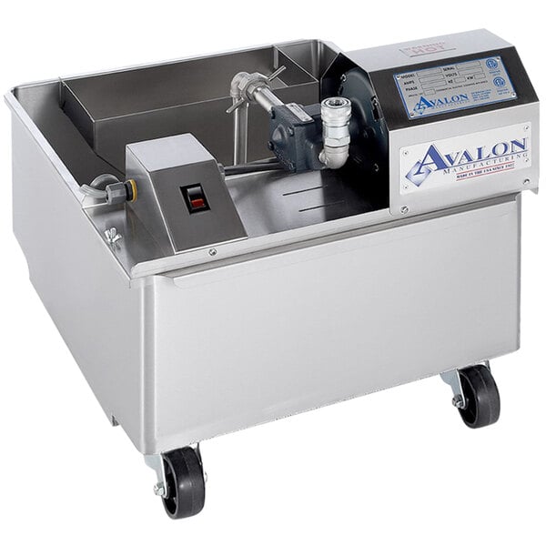 An Avalon Manufacturing oil filtration machine with a stainless steel tank and casters.