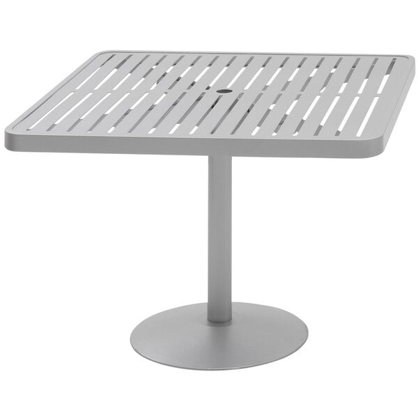 A white square Wabash Valley Hanna Collection pedestal table with horizontal slats.