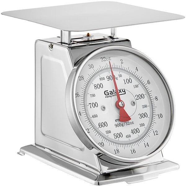 A silver Galaxy mechanical portion scale with a white dial and red and black hands.