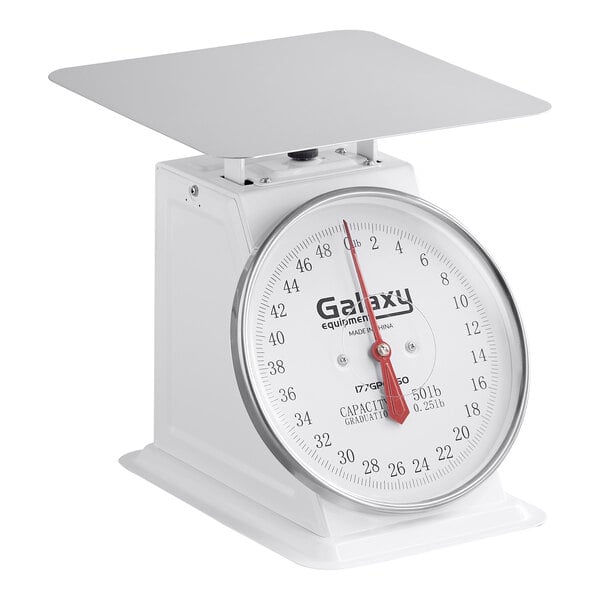 A white mechanical portion control scale with a large dial and flat weighing platform.