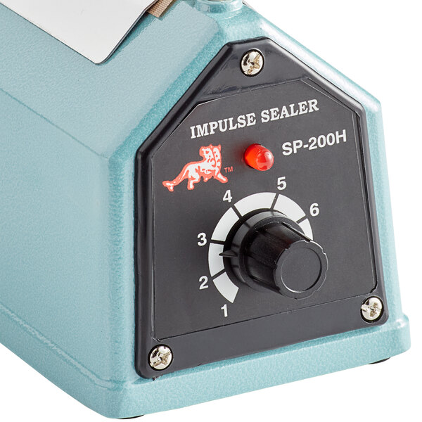A Thunder Group manual impulse bag sealer in use on a counter.