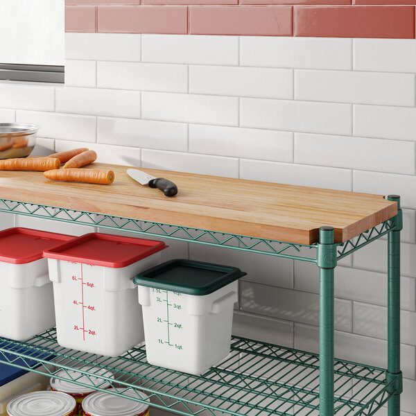 A Regency hardwood cutting board on a wire shelf above food containers.