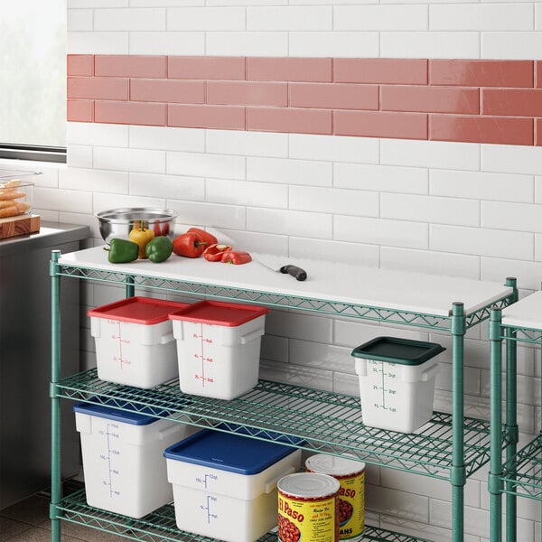 A white Regency Polyethylene cutting board insert on a wire shelf over food.