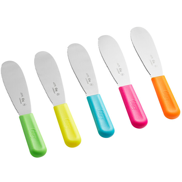 A group of Choice sandwich spreaders with scalloped edges and neon yellow, green, pink, and orange handles.
