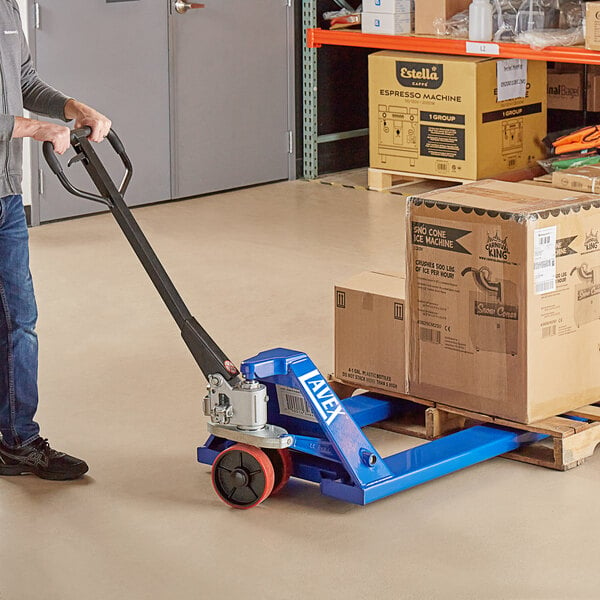 A man using a Lavex pallet jack to move boxes.