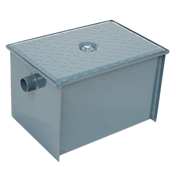 A close-up of a grey metal Watts WD-15 Grease Trap box with a hole on top.