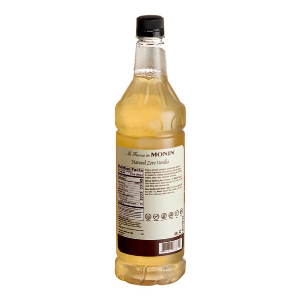 A 1-liter bottle of Monin Zero Calorie Natural Vanilla Flavoring Syrup with a black cap.