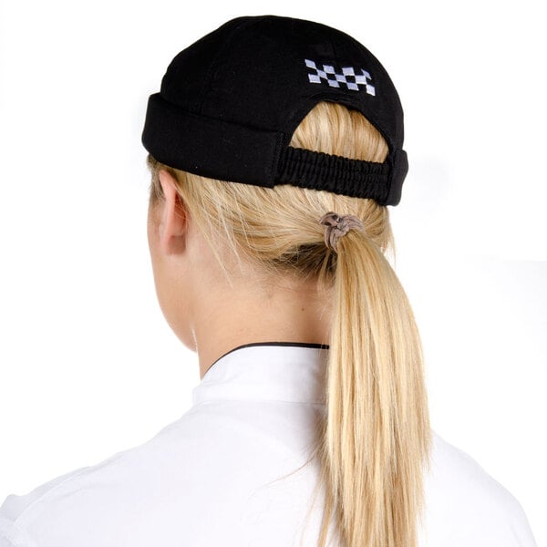 a woman wearing a black hat