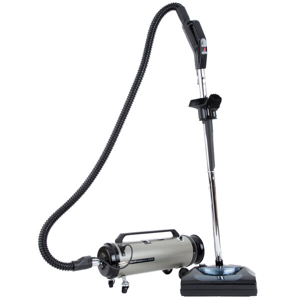 A MetroVac professional canister vacuum with a hose attached.