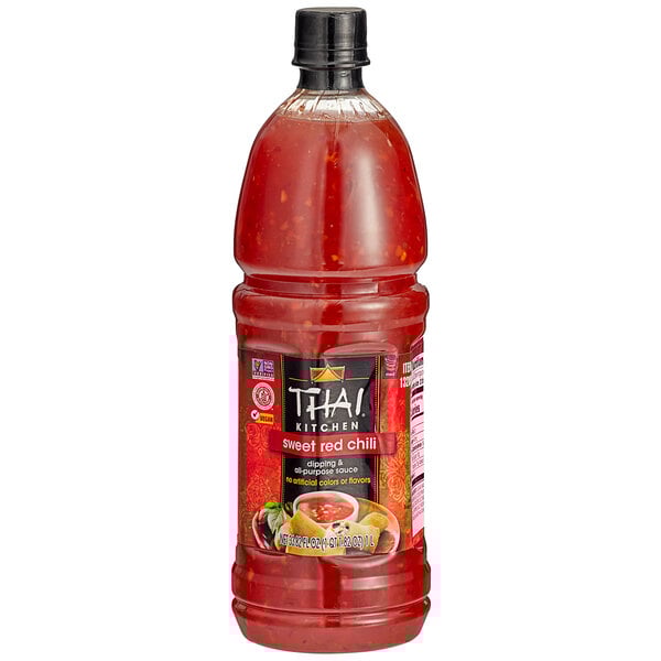 A bottle of THAI Kitchen Sweet Red Chili Sauce with a red lid.