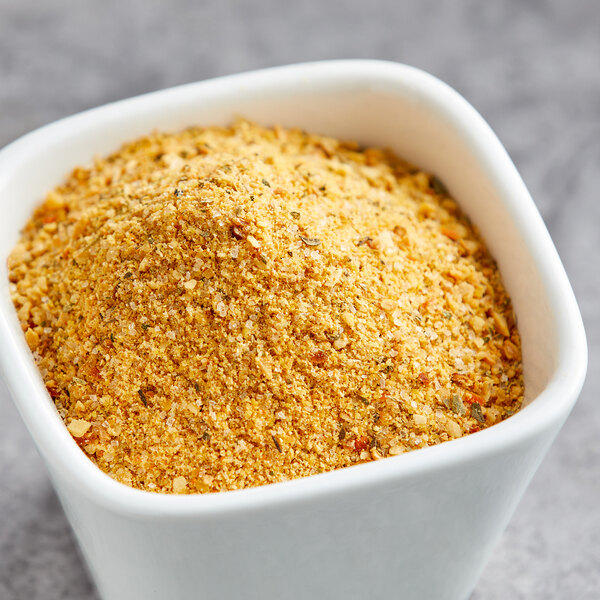 A white bowl of Lawry's Roasted Garlic Seasoning.