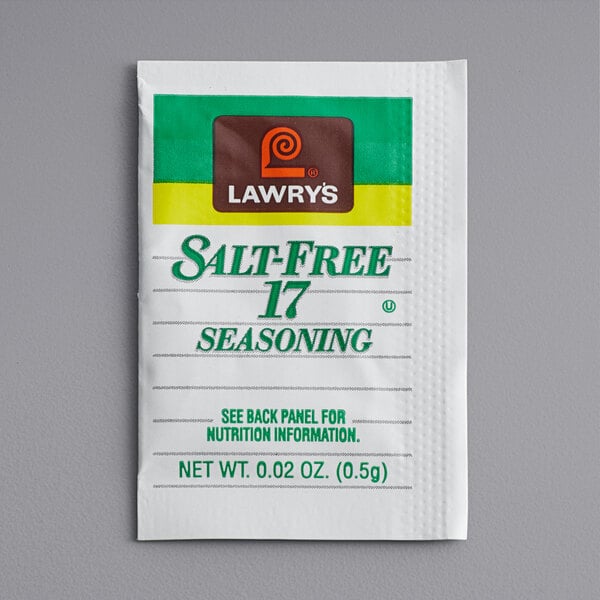 A white Lawry's salt-free seasoning packet with green and yellow text.
