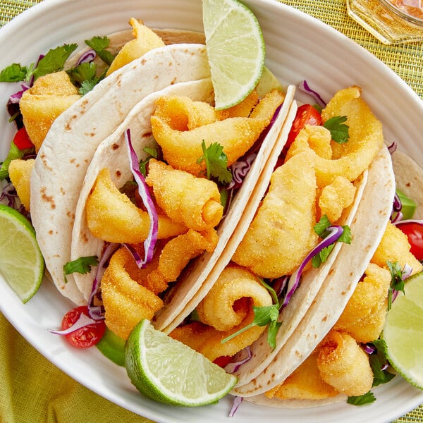A plate of food with Zatarain's Southern Style Fish Fri on a table.