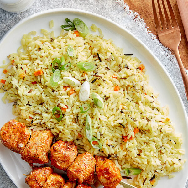 A plate of Zatarain's Creole Pilaf rice and meat.