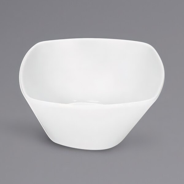 A Bauscher white square porcelain bowl with a curved edge.