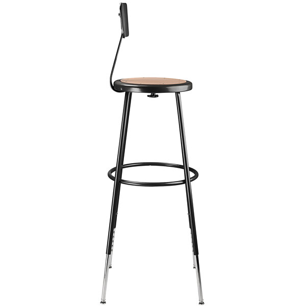 A black National Public Seating lab stool with a round hardboard seat and adjustable backrest.