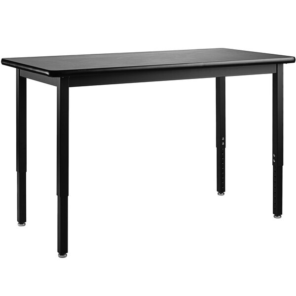 A black rectangular National Public Seating science lab table with legs.